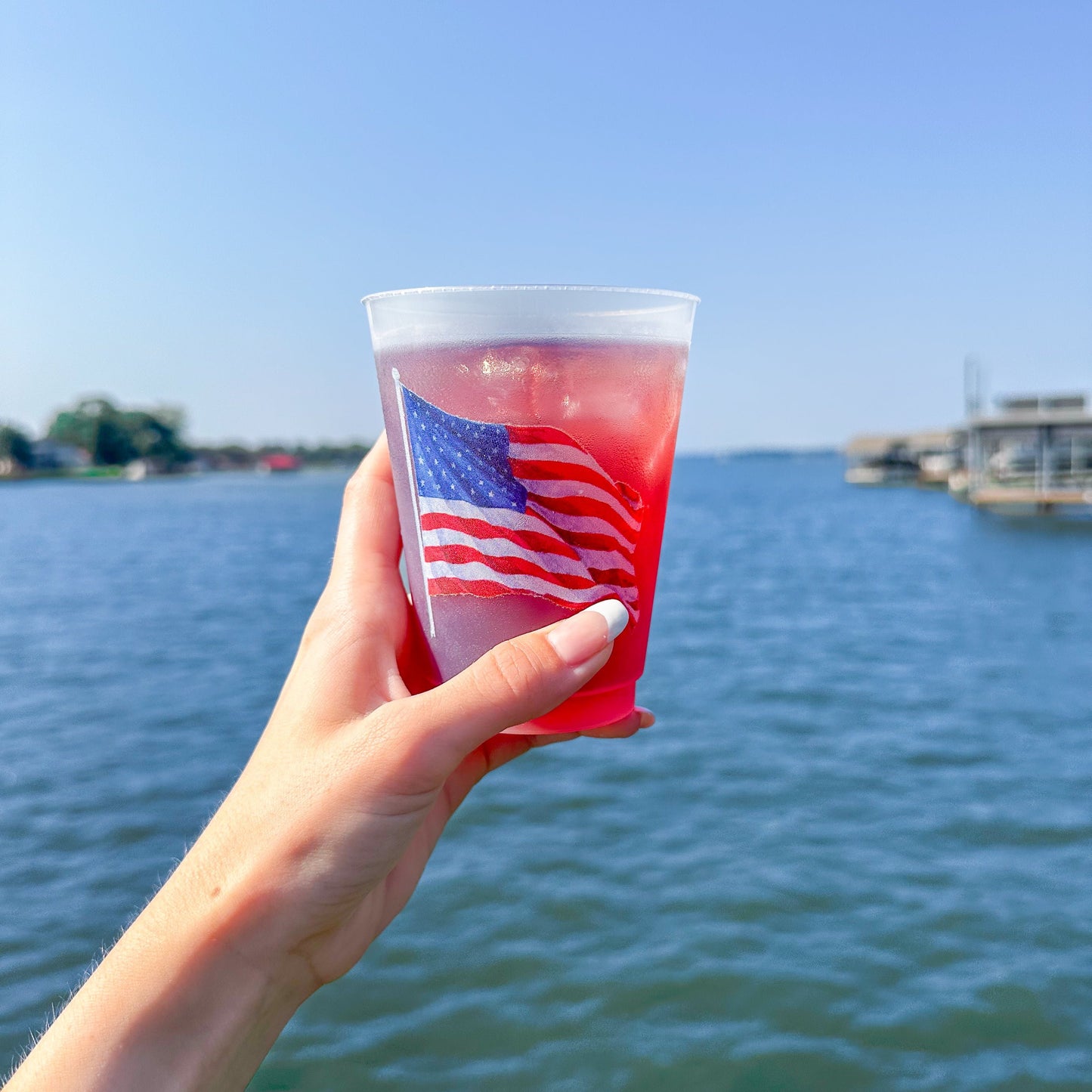 Cup with American Flag over water