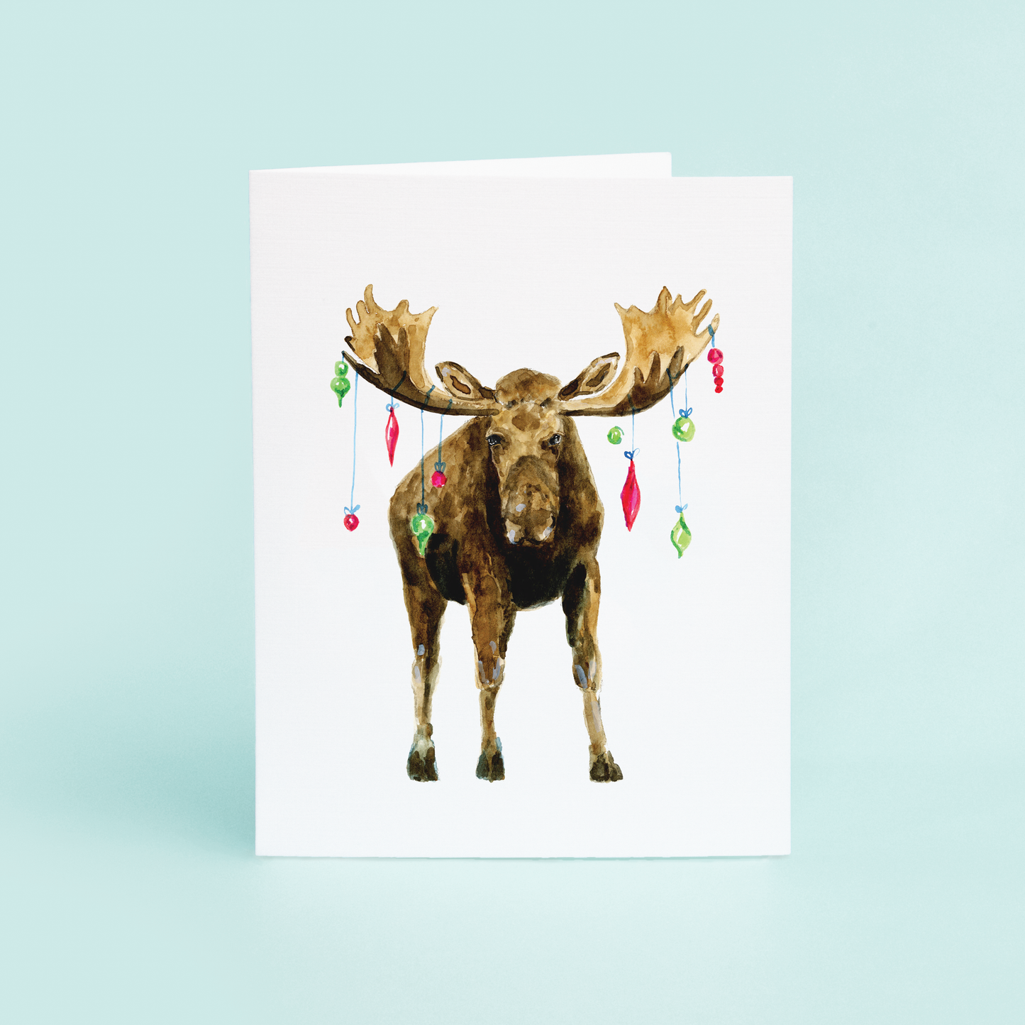 Moose with ornaments hanging from it's antlers Christmas greeting card.